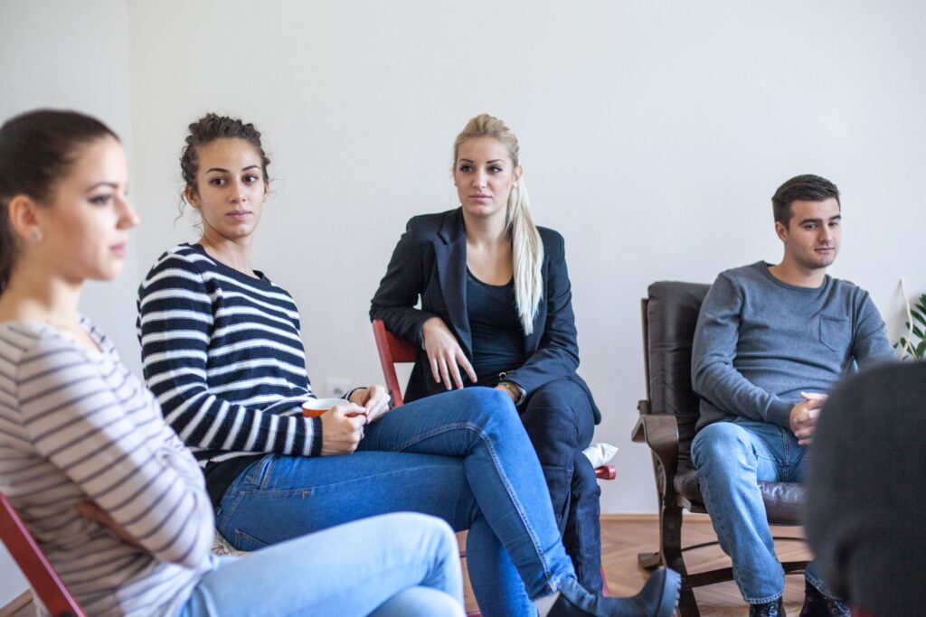 patients talking in group on what to say to someone who is self-harming